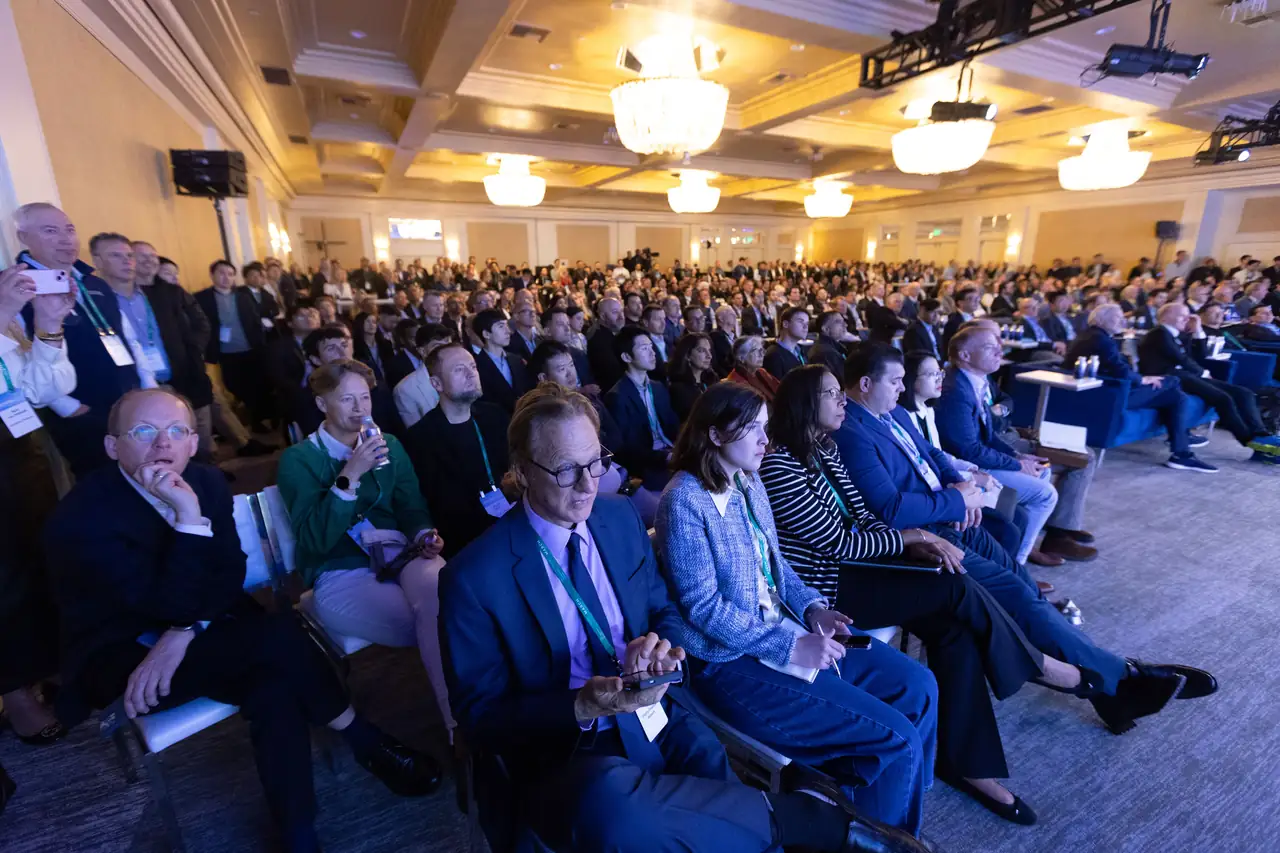 A packed ballroom listening to a session at the Montgomery Summit
